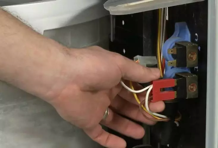 Washing machine dials water off.