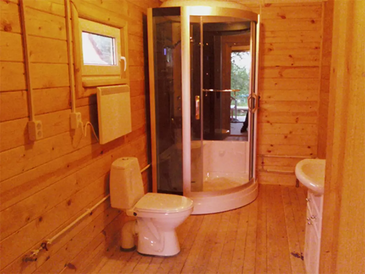 Shower cabin in a wooden house