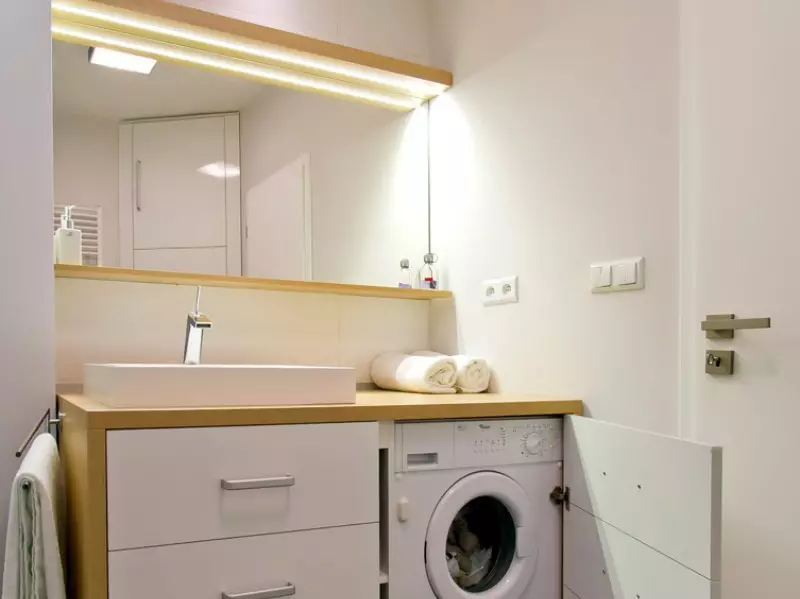 Washing Machine under the tabletop in the bathroom