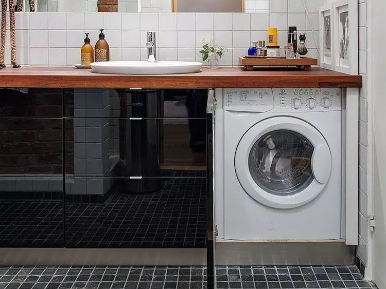 Washing Machine under the tabletop in the bathroom