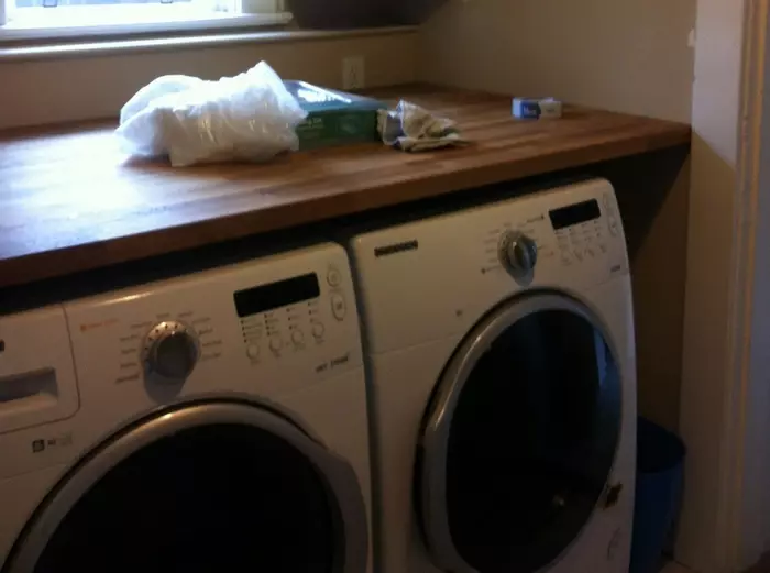 Washing Machine under the tabletop in the bathroom