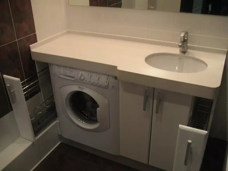 Washing Machine under the tabletop in the bathroom