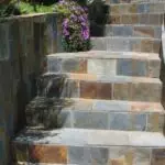 Výhody a rysy schodů z přírodního a umělého kamene (+52 fotografií)