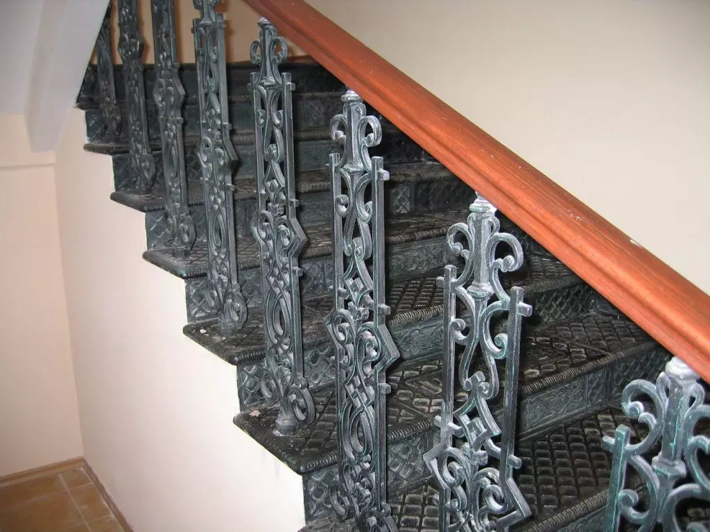 Staircase with cast-iron railings