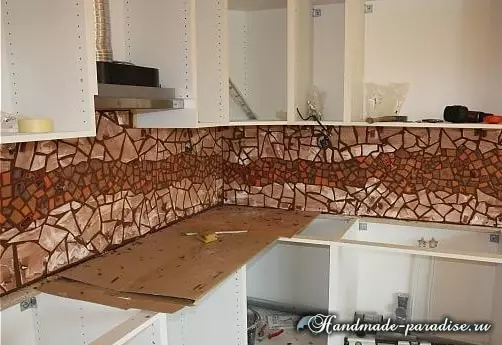 Bucătărie șorț de la mozaic cu mâinile lor