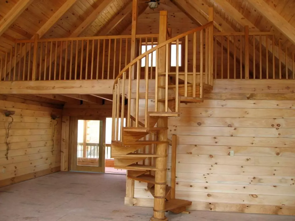 Wooden staircase spiral on attic