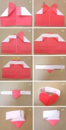 กระดาษหัวใจด้วยมือของตัวเองบนผนังในเทคนิค Origami
