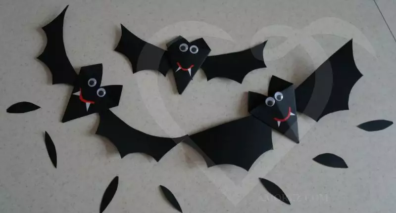 Bat of paper with her hands on Halloween with templates