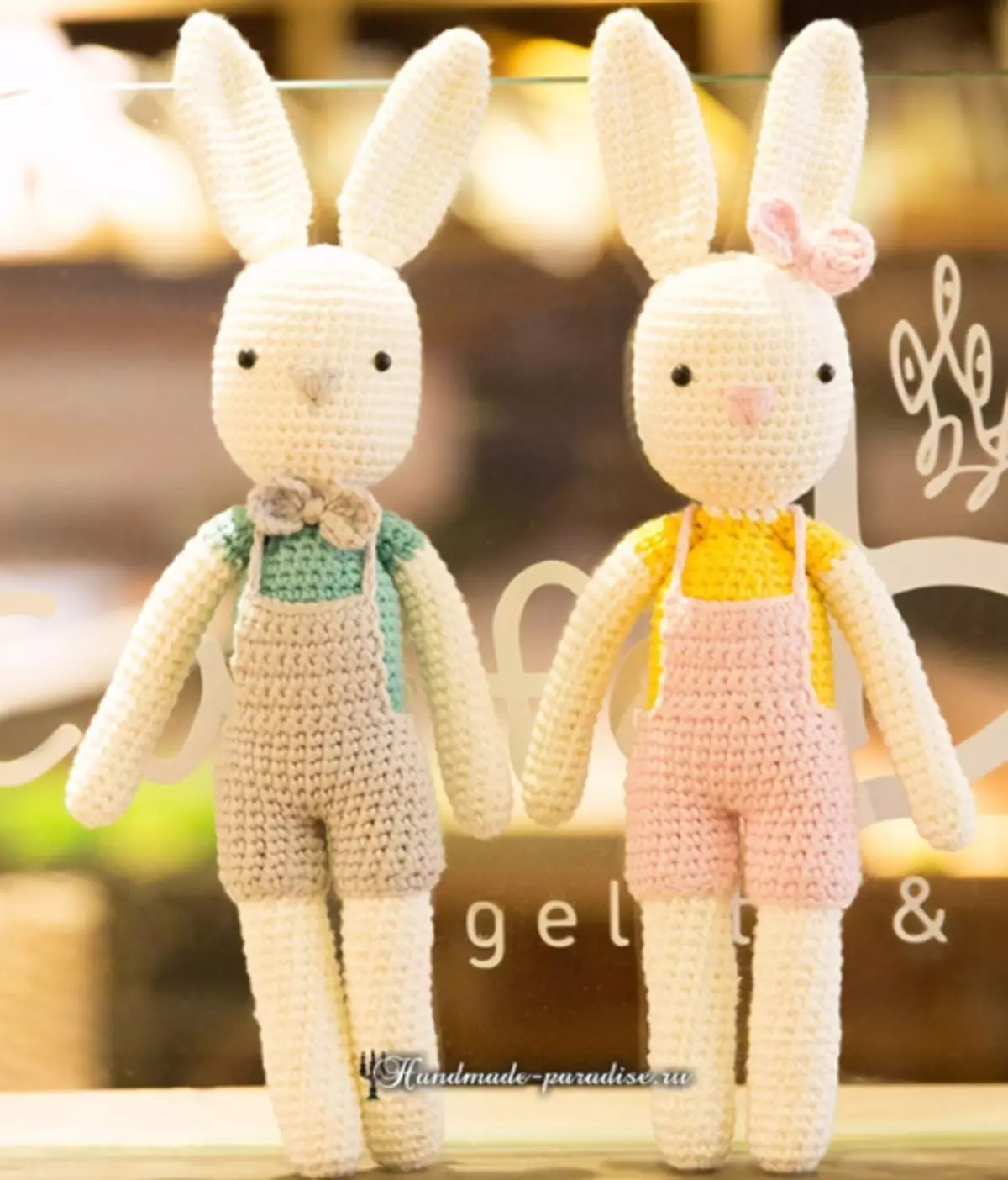 Knit crocheted eared hares at rabbits.