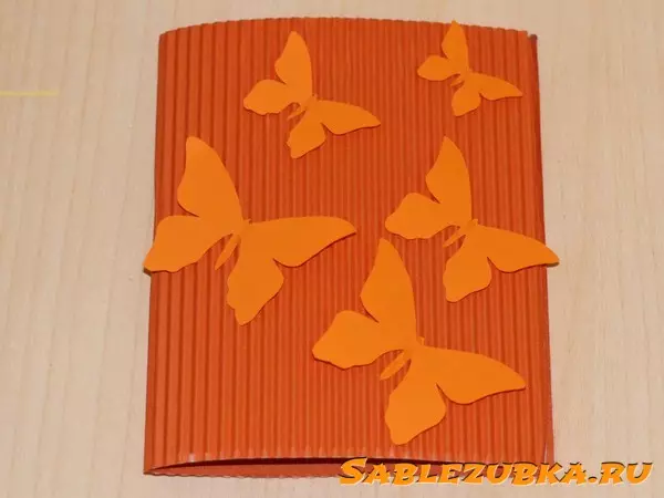 Bulk butterfly with your own hands on a postcard made of colored paper