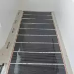 Isendlalelo esifudumele seselula noma i-heating mat ngaphansi kwekhaphethi: Yini futhi yini izinzuzo zayo?