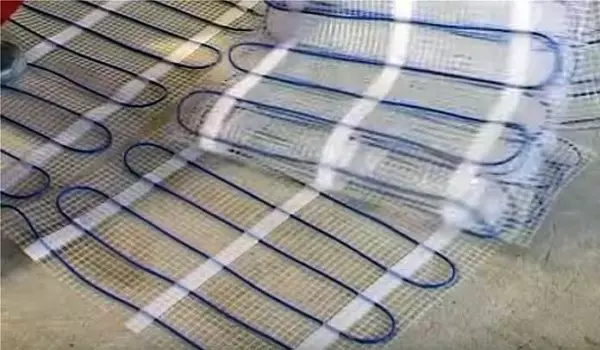Het leggen van elektrische verwarmingsvloer onder laminaat en tegel