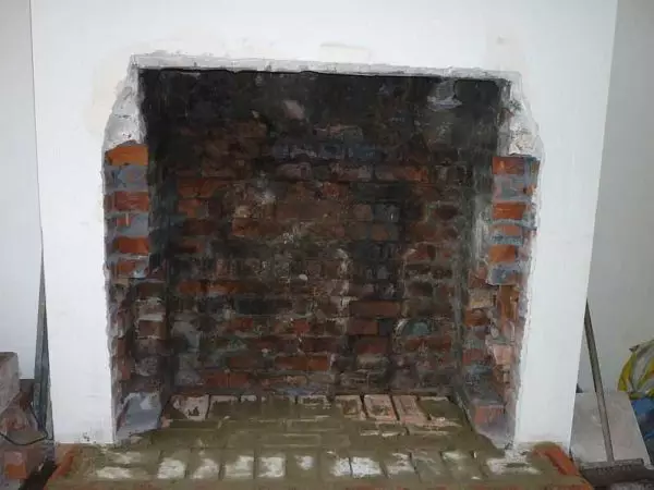 Paano paghiwalayin ang fireplace: plaster, cladding tile, bato