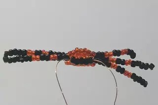 Spider of beads with a scheme and description for beginners