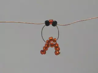 Spider of beads with a scheme and description for beginners